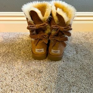 Women’s UGG boots, bow detail on back, have been worn but lots of life left